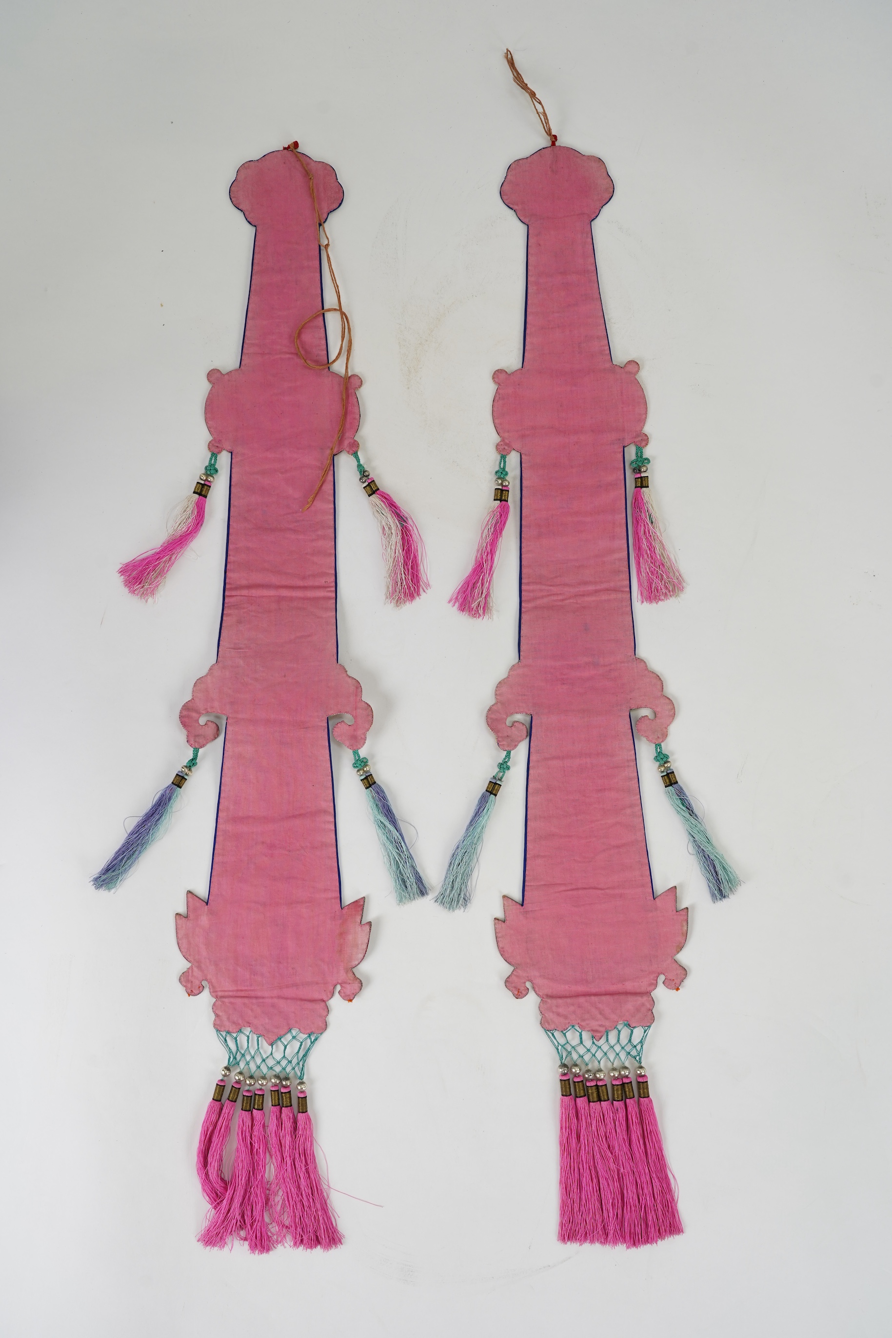 A pair of Chinese embroidered silk hanging pendants, early 20th century